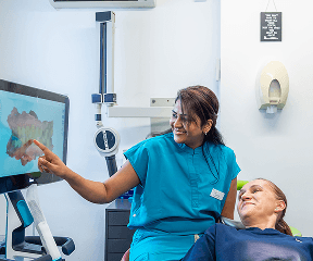 Dentist giving aftercare advice after restorative dentistry in Milton Keyne