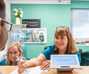 Patient receiving guidance for caring for a dental crown