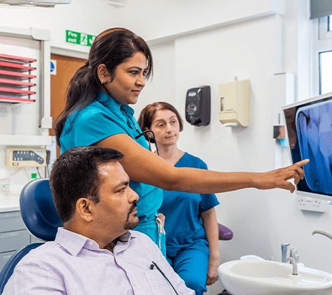 Dentist discussing porcelain veneers with a patient