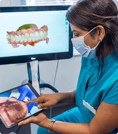 Dentist giving TMJ self-care advice